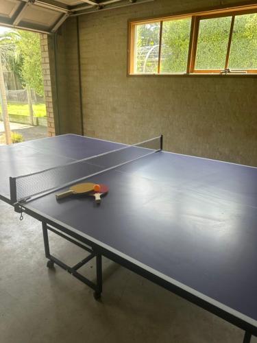 a large ping pong table in a room at StaySorrento in Sorrento