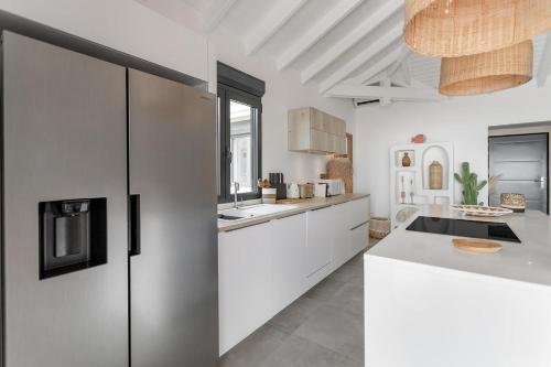 a kitchen with white cabinets and a counter top at 3-bedrooms Villa 5min from Orient Bay in Cul de Sac