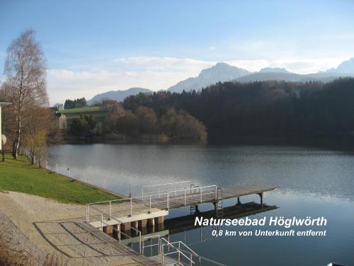 a dock with a bench on the side of a lake at Ferienwohnung Anneliese Eckhart in Anger