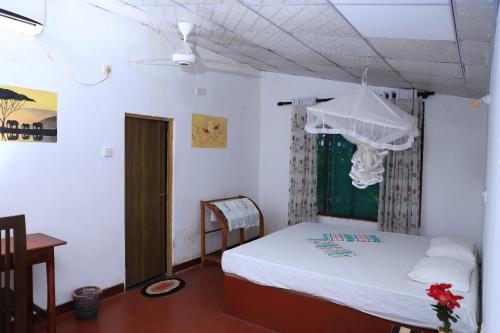 Postel nebo postele na pokoji v ubytování Beach Raised Guest House