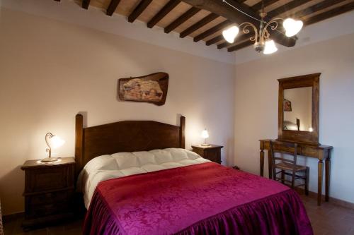 Кровать или кровати в номере Poggio Al Vento