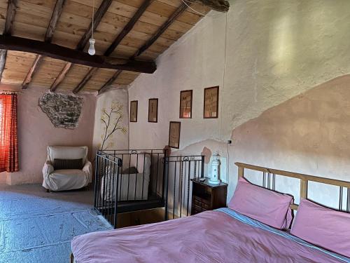 Кровать или кровати в номере la casa del calicanto