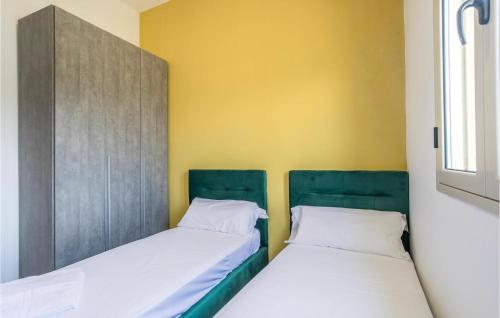 two beds sitting next to each other in a room at 8 Bedroom Gorgeous Home In Cava D'aliga in Cava dʼAliga
