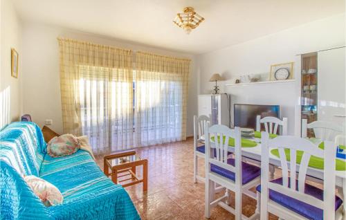 a living room with a couch and a table at Awesome Apartment In Santa Pola in Santa Pola