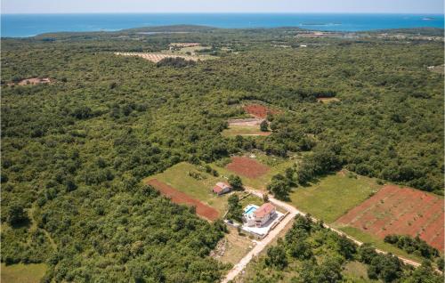 an aerial view of a house in the forest at Stunning Home In Bale With Wifi in Bale