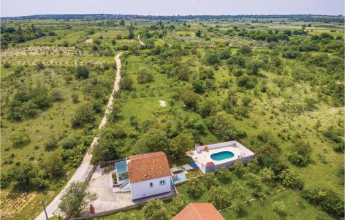 an aerial view of a house with a swimming pool at Holiday Home Podgradina 01 in Gradina