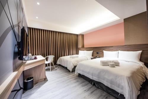 Postel nebo postele na pokoji v ubytování SIX FUKUN HOTEL