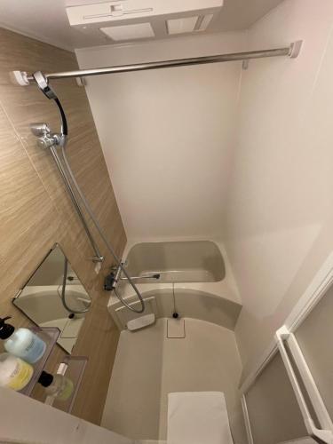 a bathroom with a shower and a toilet at Guest House Goettingen in Kyoto