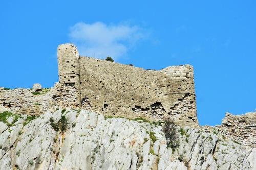 a castle on the side of a mountain at Villa Haraki Paradise in Haraki