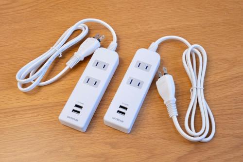 a couple of nintendo wii controllers sitting on a table at OSAKA COZY HOUSE For Family & Group 2bedroom in Takaishi