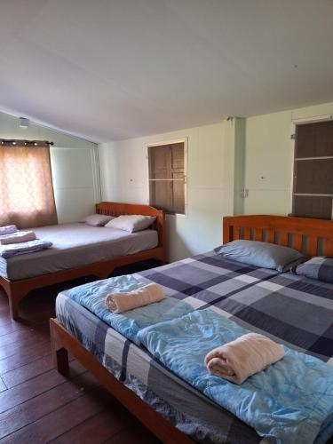 Cama o camas de una habitación en ป่ากล้วยริเวอร์ไซด์รีสอร์ท