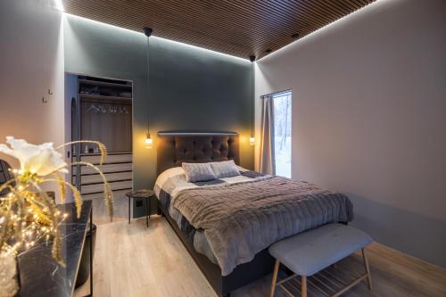 a bedroom with a large bed and a window at Santa's Royal Resort in Rovaniemi