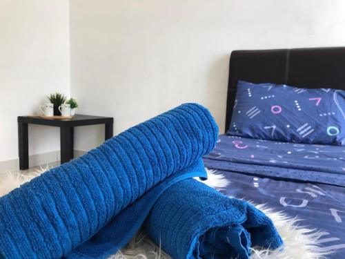 Una cama o camas en una habitación de Ampang 4-6 pax in Ampang Point