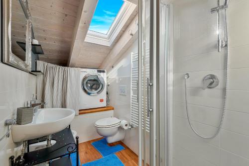 a bathroom with a sink and a toilet and a shower at Loft&Sun in La Spezia