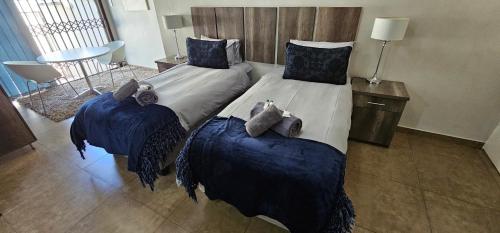 Postel nebo postele na pokoji v ubytování Blue Sparrow Guest House