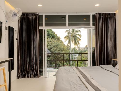 Postel nebo postele na pokoji v ubytování Moonway Bungalows