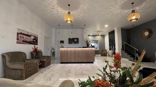 a lobby with chairs and a table in a building at Europa Ocna Mures in Ocna-Mureşului