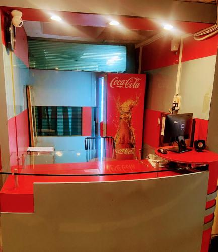 a coca cola counter in a fast food restaurant at Hotel Phool Plaza in Kota