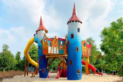 a playground with a castle play structure at ZEN-bungalow no 6 met sauna en hottub in Rheezerveen