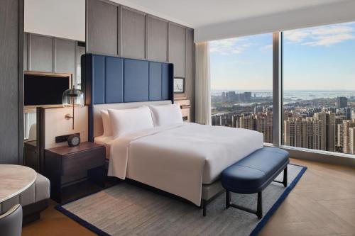 Ένα ή περισσότερα κρεβάτια σε δωμάτιο στο Le Meridien Nantong