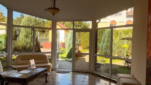 a living room with a large glass door at Гранд Алексік in Truskavets