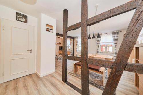 a room with a staircase leading to a dining room at Fachwerkperle am historischen Marktplatz in Bernkastel-Kues