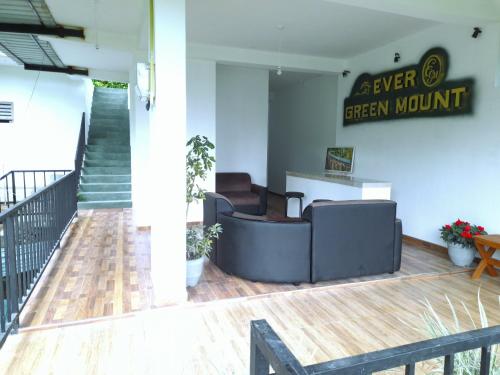 a lobby of a green mountain office with a desk at Ever Green Mount in Ella