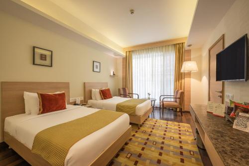 Postel nebo postele na pokoji v ubytování Echor Shimla Hotel - The Zion