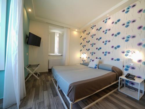Ένα ή περισσότερα κρεβάτια σε δωμάτιο στο Villa Adua