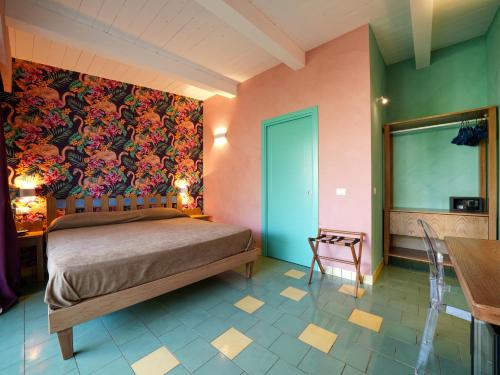 Ένα ή περισσότερα κρεβάτια σε δωμάτιο στο Villa Adua