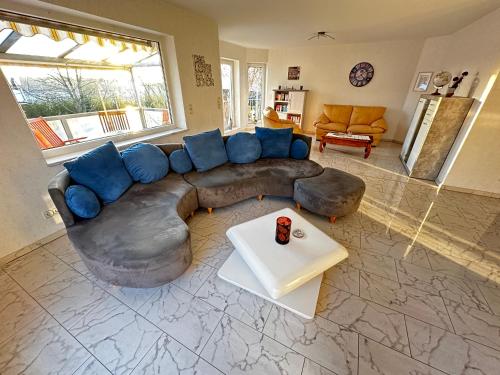 a living room with a large couch and a table at Villa Hardegsen in Hardegsen