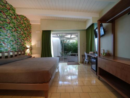 Ένα ή περισσότερα κρεβάτια σε δωμάτιο στο Villa Adua