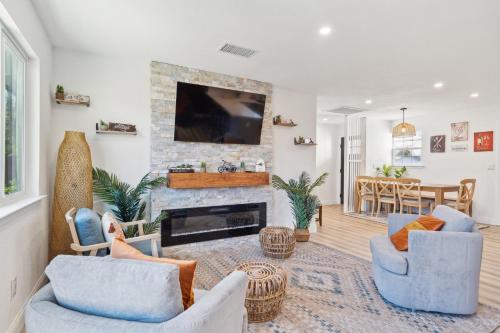 a living room with two chairs and a fireplace at Cozy Home with Hot Tub - Family-Friendly Yard home in Livermore