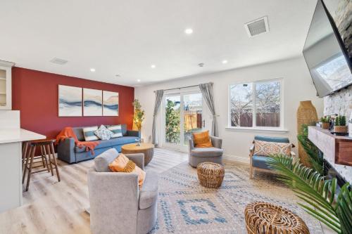 an open living room with furniture and a kitchen at Cozy Home with Hot Tub - Family-Friendly Yard home in Livermore