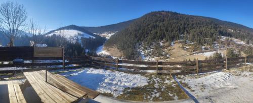 a view of a snow covered mountain with a fence at Chez Jo in Villard-de-Lans