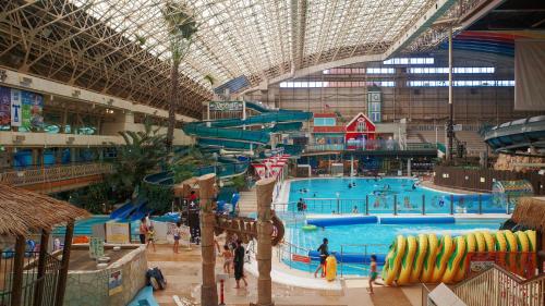 a large indoor swimming pool in a large building at Taira View Hotel in Iwaki