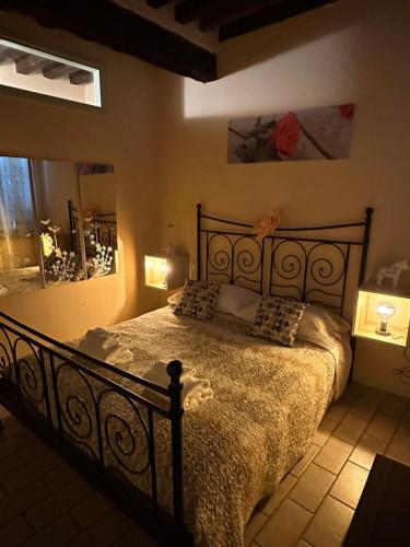 a bedroom with a large bed in a room at Naviglio 34 in Parma