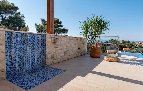 a bathroom with a shower on a patio at Pet Friendly Home In Prigradica in Prigradica