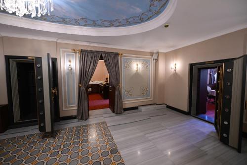 a room with a chandelier and a room with a bedroom at Ring Stone Hotels Old City - Special Class in Istanbul
