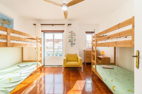 Ένα ή περισσότερα κρεβάτια σε δωμάτιο στο Baleal Happiness Surf House