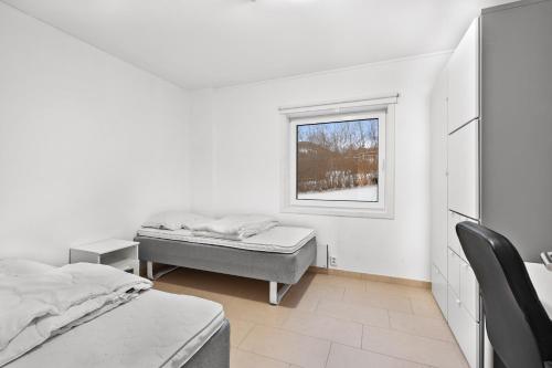 Postel nebo postele na pokoji v ubytování Namsos Hybelhus