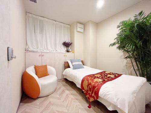 Postel nebo postele na pokoji v ubytování MIYAVI hotel