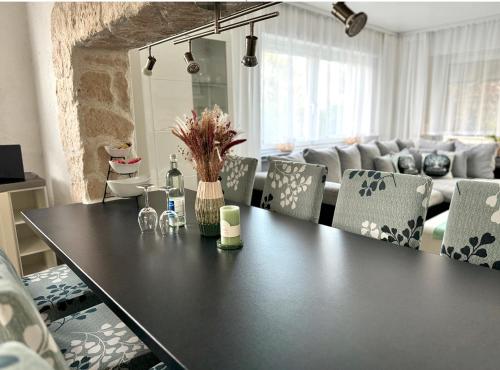 a table and chairs in a living room at Refugium 2020 in Marienheide