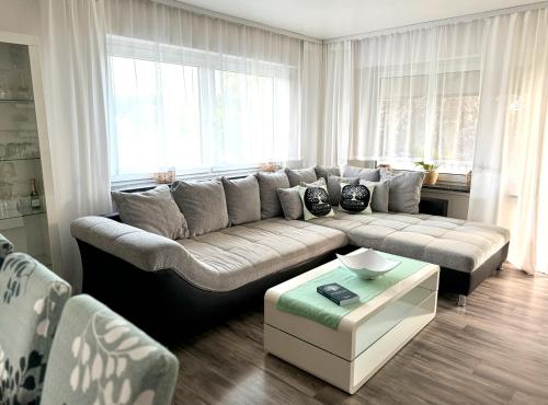 a living room with a couch and a table at Refugium 2020 in Marienheide