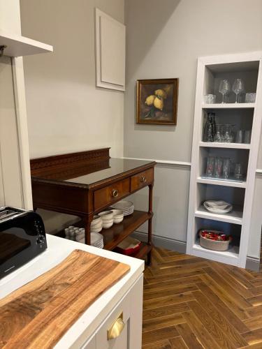 a kitchen with a piano in the corner of a room at The Blue Door in Castleisland