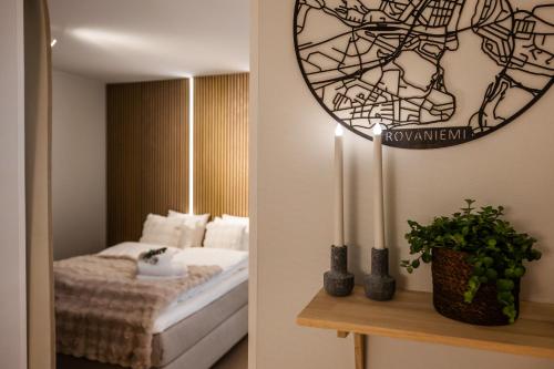 a bedroom with a bed and a mirror on the wall at Arctic Honey City Suite in Rovaniemi
