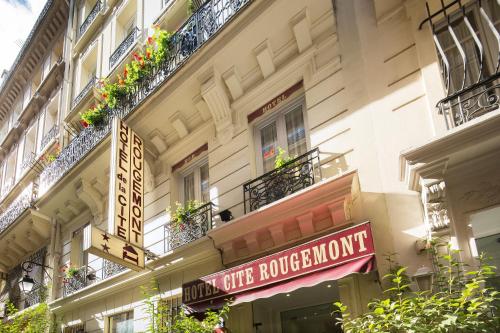 a store front with a sign for a restaurant at Hotel De La Cite Rougemont in Paris
