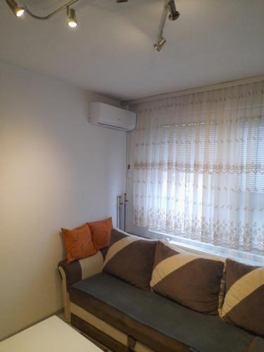 Ένα ή περισσότερα κρεβάτια σε δωμάτιο στο Palma Apartman