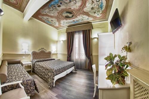 Кровать или кровати в номере Hotel Pedrini