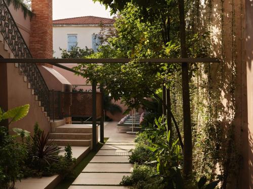 a stairway leading to a house with plants at Domus Blanc Boutique Hotel in Chania Town